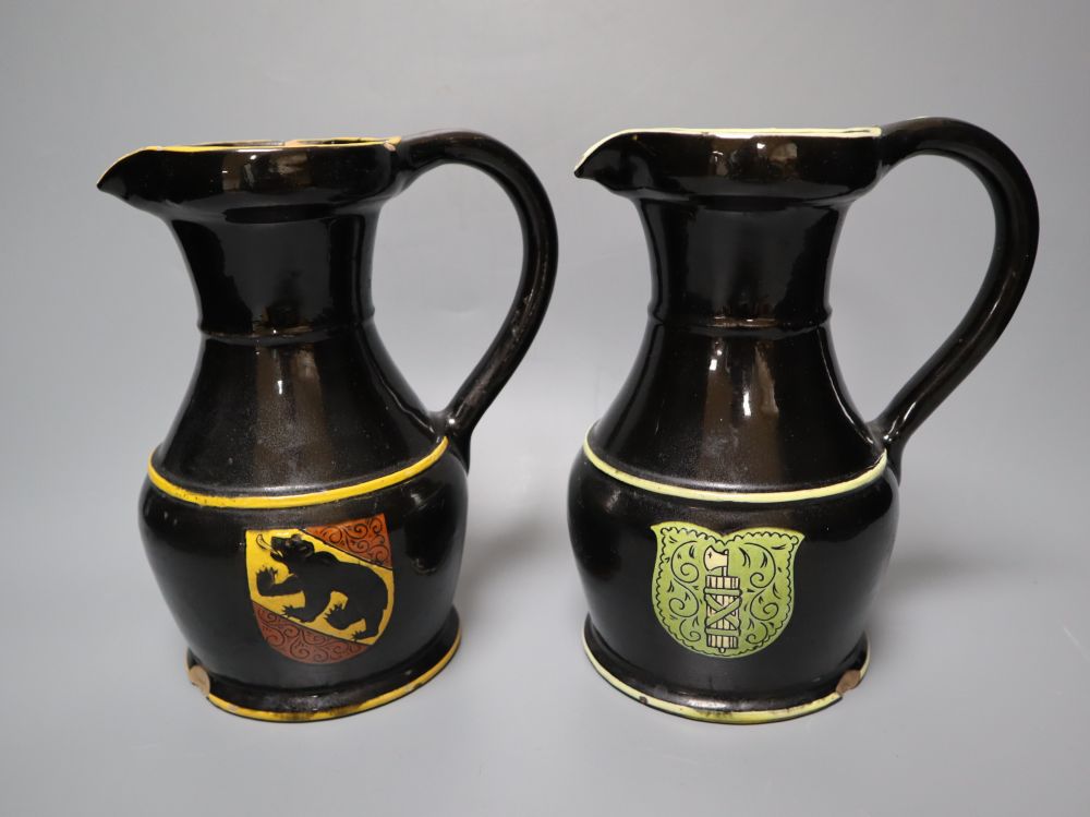 A part-set of 19th century Swiss glazed terracotta items, signed, Desa Steffisburg, each with sgraffito crest, jugs 20cm, and a Rouen s